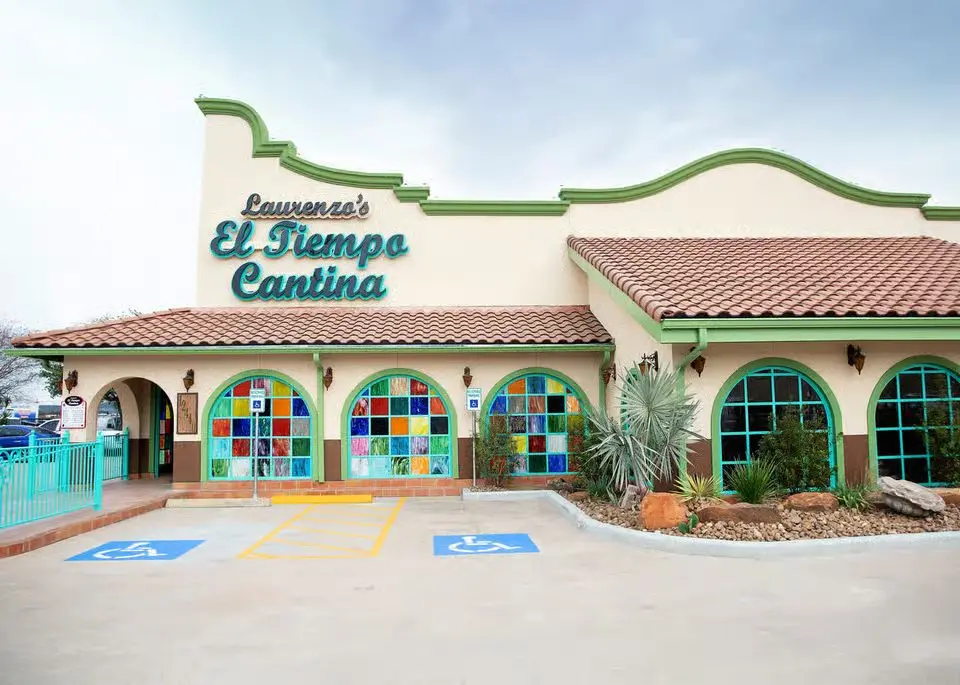 Exterior of the El Tiempo Cantina 290 restaurant with its stained-glass arched windows
